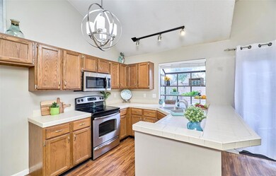 Kitchen with garden window & breakfast bar.Lower c