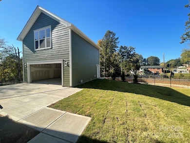 2 car rear detached garage has a finished bonus, wetbar and full bath