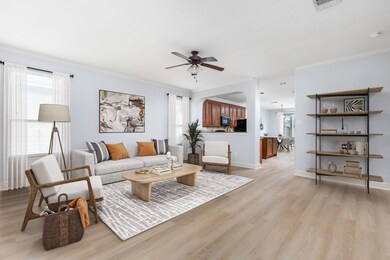 Living area with light wood finished floors, a ce