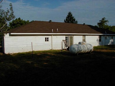 Other. Back of home; 500 gal propane tank stays.