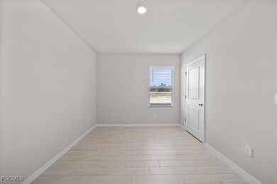 Empty room featuring light wood-style floors and baseboards