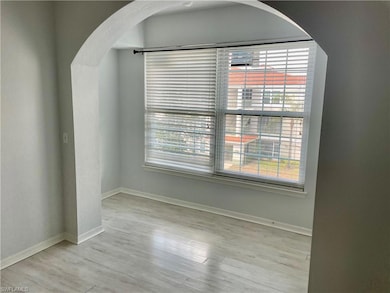 Empty room featuring light hardwood / wood-style f