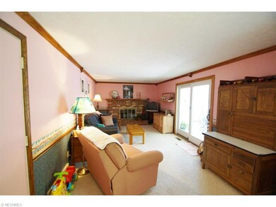 View of Family Room with Gas and Wood Burning Fire