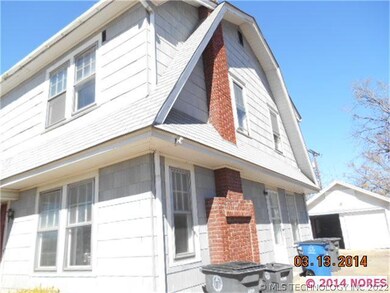 Opposite view, brick chimney.