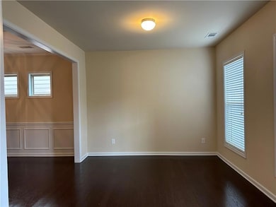 Unfurnished room with plenty of natural light, vis