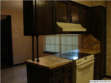 Kitchen view showing smooth top stove.