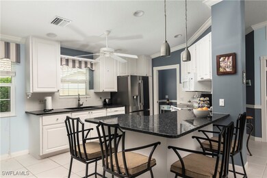 Kitchen featuring stainless steel fridge with ice