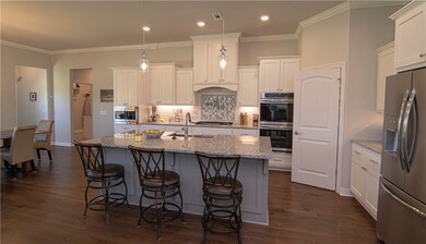 kitchen w large island, owners added end cabinet