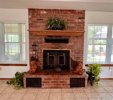 Brick fireplace in the grand living room

