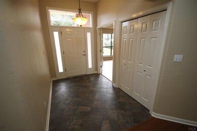 10.6 x 6.6 foyer w/tile flooring & coat closet.