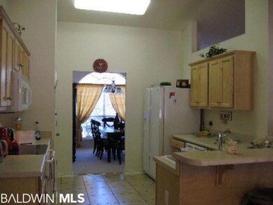 Kitchen offers electric range, built-in microwave