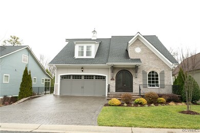 View of front facade with a front yard and a garag