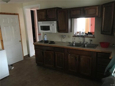 Kitchen, needs repairs and updating.