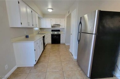 Kitchen featuring visible vents, light countertops