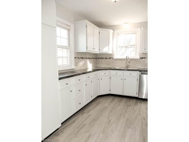 Kitchen has new flooring, new countertops, tile ba