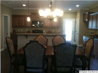 The open dining room with a kitchen bar is perfect