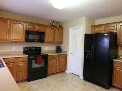 Kitchen. Another view of the kitchen showing even more cabinetry.  This kitchen also offers a giant, expansive pantry.  Be sure to look at it during your visit to the home!