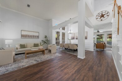 Dramatic high ceilings in living room.