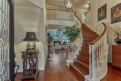 This inviting two-story entryway features a grand,