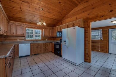Kitchen with view into laundry room