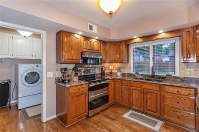 Laundry room and powder room located off the kitch