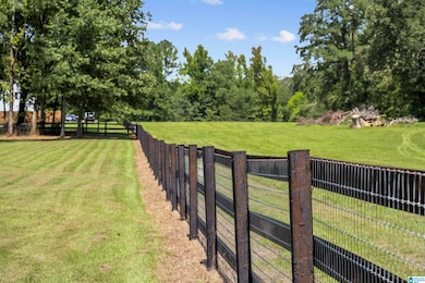 The fence outlines the 2.02 acres.
