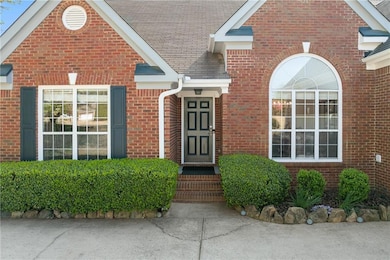 Property entrance featuring brick siding and a shi