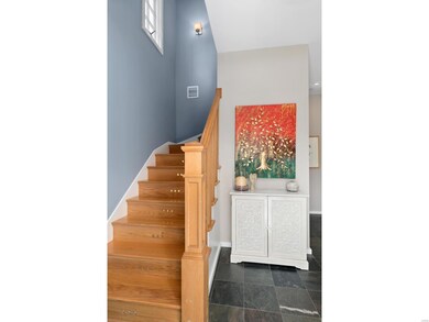 Lighted stairway to 2nd floor