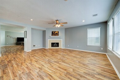 Den view. Gas log fireplace.