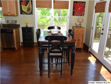 The dining area is open to the kitchen and the liv