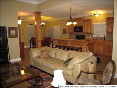 LIVING ROOM OPENS TO KITCHEN