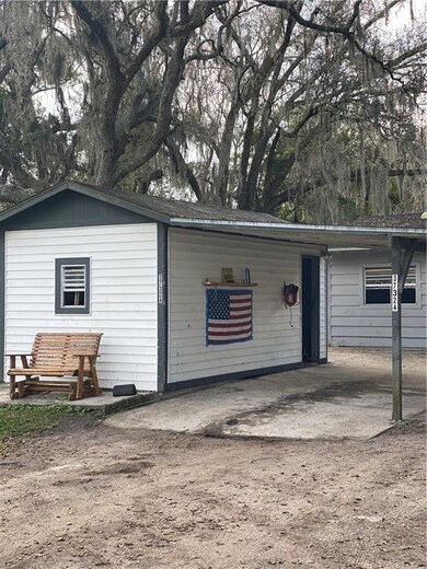 Carport with attached workshop