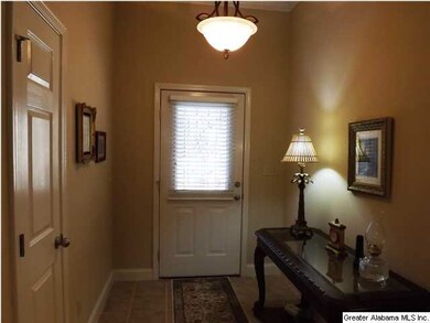 Pleasant and attractive foyer with coat closet.
