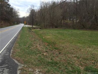 View of front portion of lot facing paved road fro