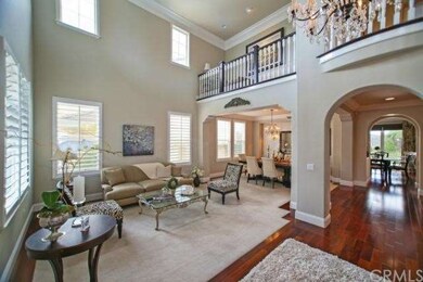 Formal Living Room Features Soaring Ceilings, Crow