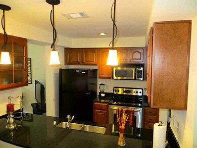 Kitchen has granite counters and beautiful cabinet