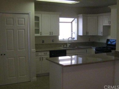 Kitchen area behind doors is washer and dryer hook