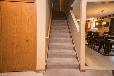 open staircase leading to 3 bedrooms upstairs.