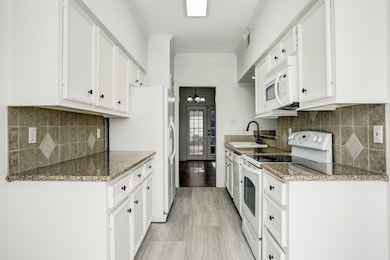 Granite counters w/tile backsplash