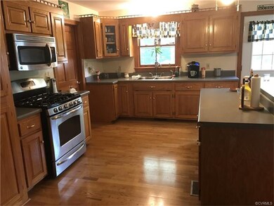 Solid Oak Cabinets with Stainless Steel Gas Range,