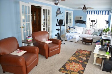 Large cozy family room with crown molding