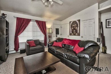 A cute-as-can be railed and covered front porch en