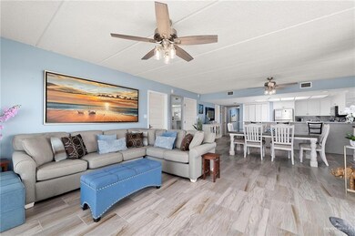 Living room featuring ceiling fan and light wood finished floors