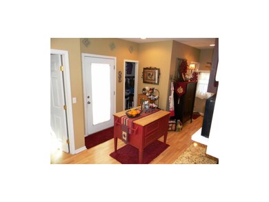 Kitchen space includes huge pantry beyond the door