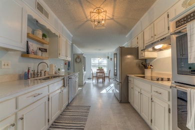 New flooring and stainless steel appliances