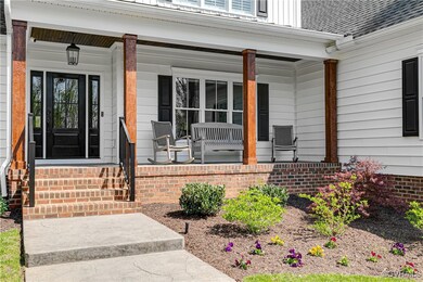Stamped concrete walkway up to covered front porch