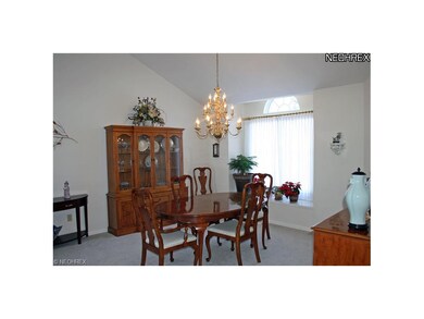 Neutral decor, open concept formal Dining room is 
