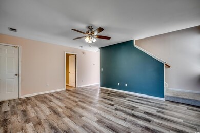 Unfurnished living room with wood-type flooring an
