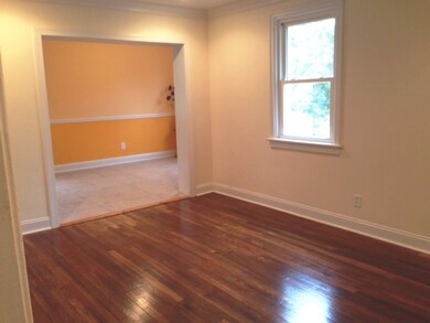 Another view of living room and dining area