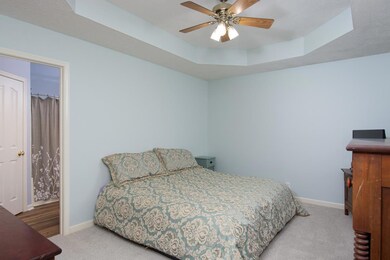 Fresh paint and new carpet, plus vaulted ceiling make this a relaxing master bedroom. 